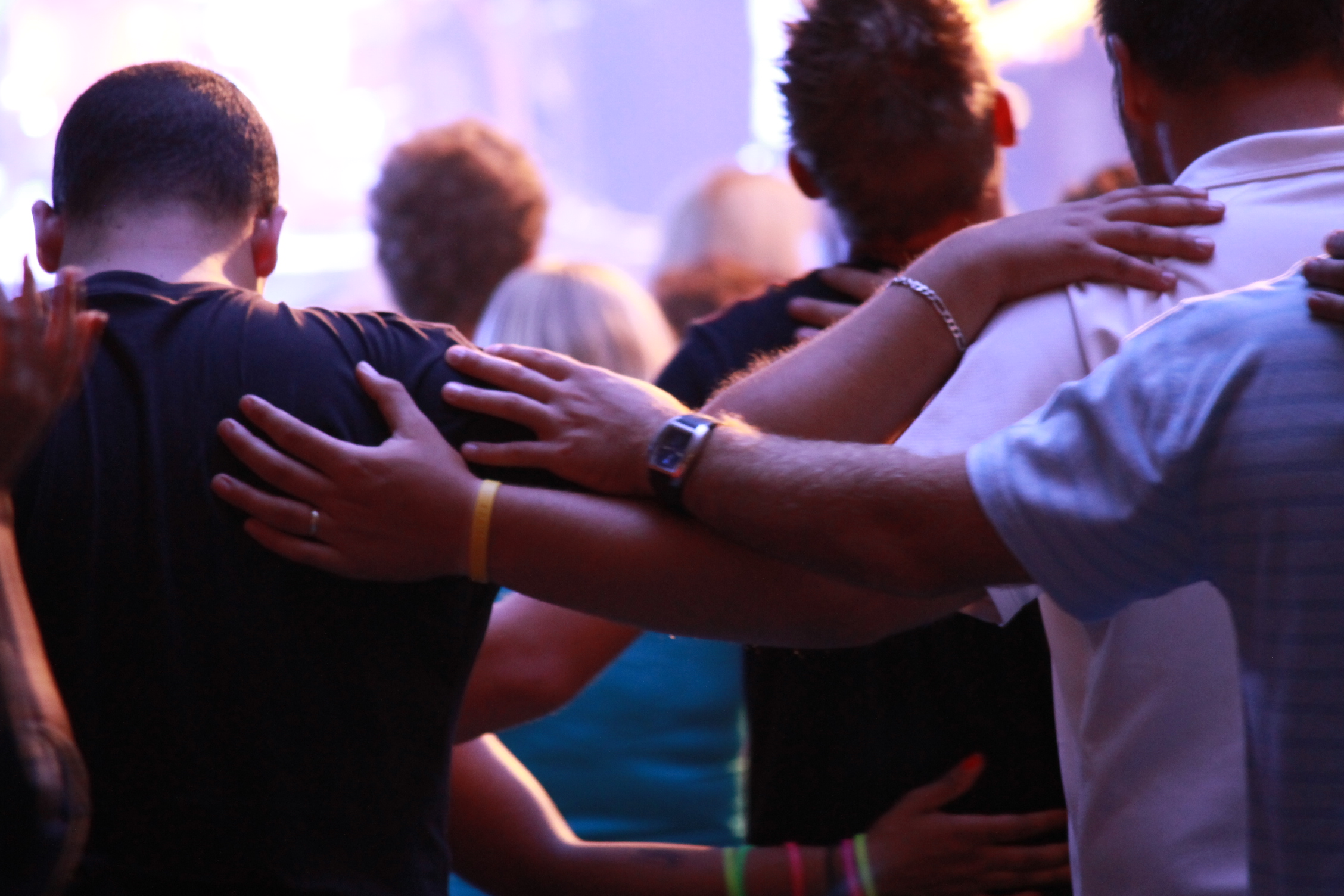 people gathered in prayer