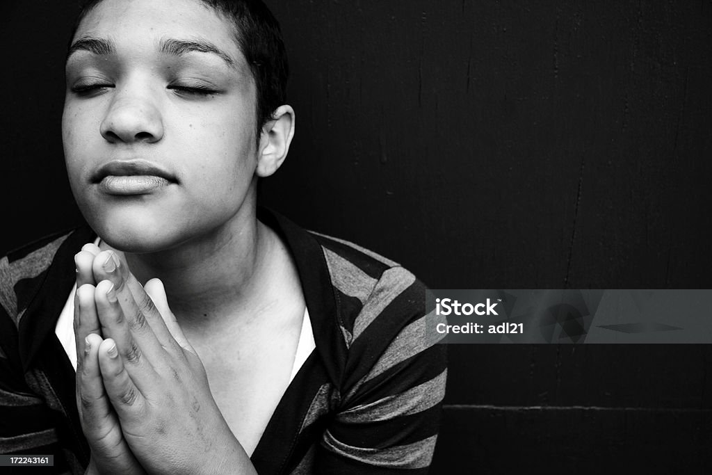 Person praying in a quiet room