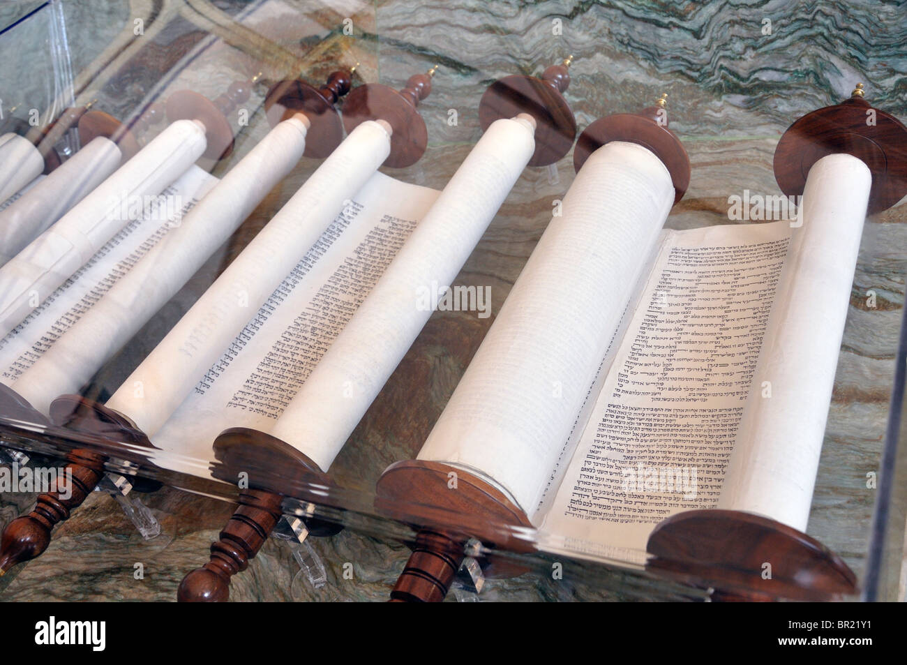 Ancient biblical scrolls with Hebrew script, symbolizing divine knowledge