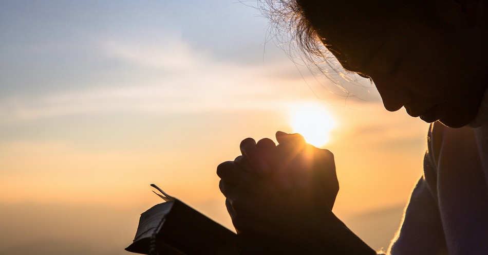 Christian man praying for forgiveness