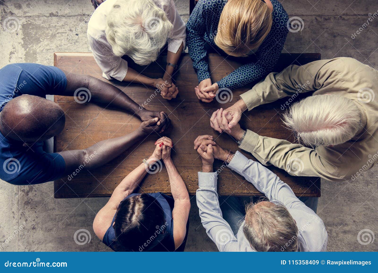 Prayer hands in diverse church setting