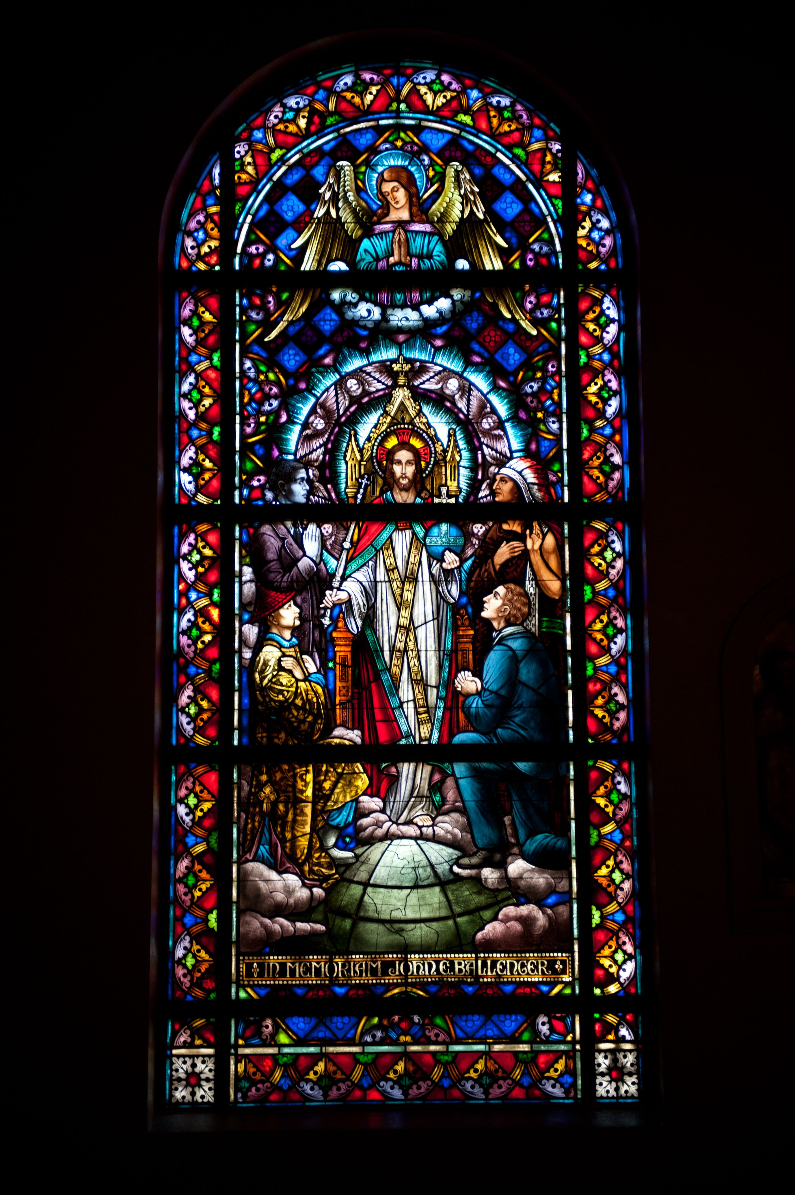 Stained glass window in church depicting biblical scenes